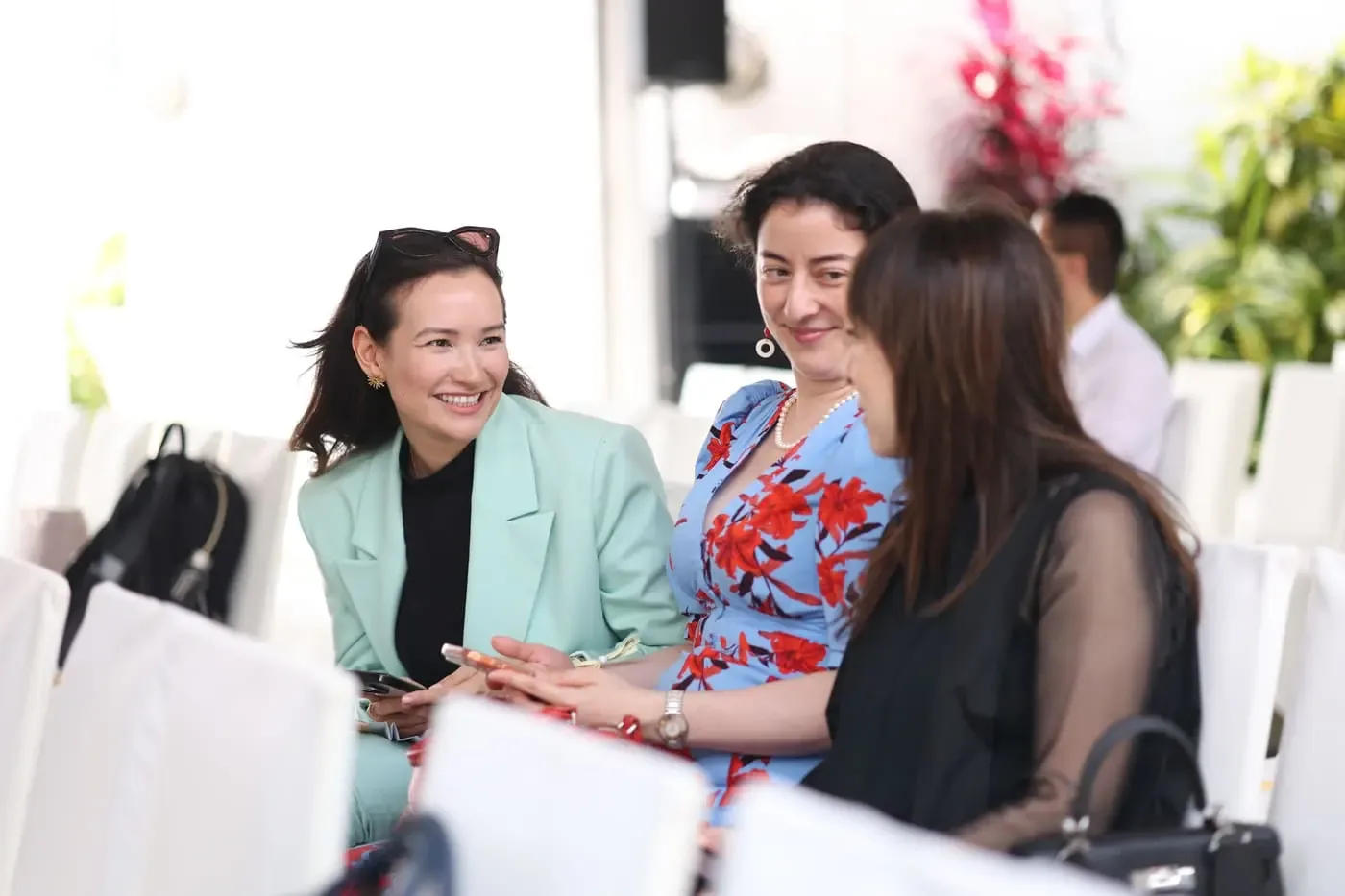 Genesis members networking in the lounge
